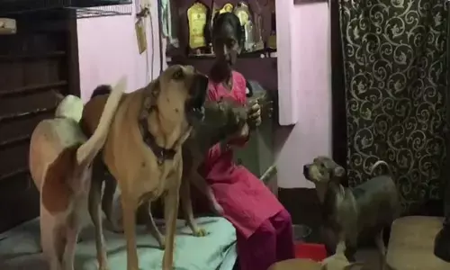 Rajni Shetty with her dogs at her house in Mangaluru