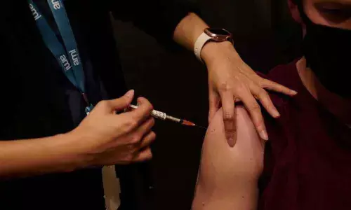 Australia cuts Covid booster shot interval