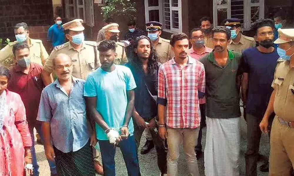 The five goons and the couple Anirudhan Palora and wife Ajitha, who hired them, at Chevayur police station