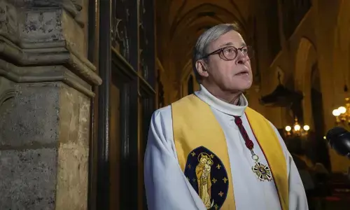 Notre-Dame de Paris cathedrals rector Patrick Chauvet gestures as he speaks during an interview with The Associated-Press at Saint Germain lAuxerrois church in Paris