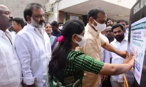 MLA Bhumana Karunakar Reddy pasting sticker posters of Kabaddi tourney to auto rickshaws in Tirupati on Saturday. Mayor Dr R Sirisha, Deputy Mayor Mudra Narayana, Additional Commissioner Haritha and Sports organiser Penna Bhaskar are also seen