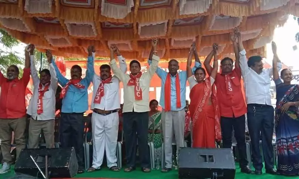 AITUC state general secretary Obulesu and other leaders participating at its 15th district convention in Tirupati on Sunday