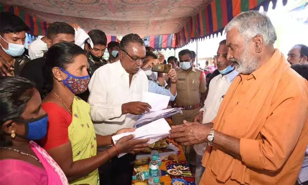 Minister for Panchayat Raj Peddireddi Ramachandra Reddy receiving representations from people of Sodum mandal on Sunday