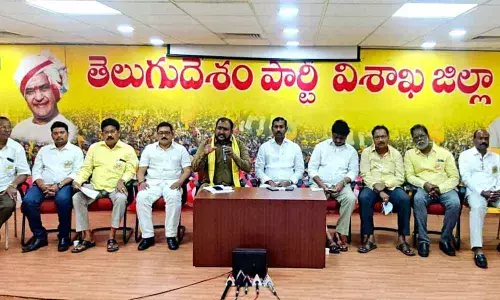 TNTUC State president G Raghurama Raju speaking to the media in Visakhapatnam on Sunday