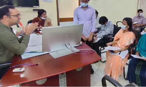 District Collector Shrikesh B Lathkar holding a review meeting on paddy procurement with officials in Srikakulam on Sunday
