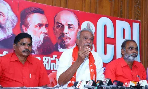 CPI national secretary K Narayana speaking to reporters in Tirupati on Sunday