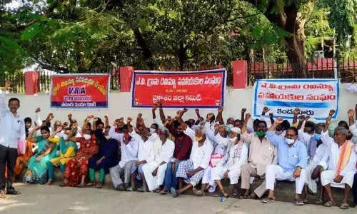 AP VRA Association Prakasam district unit members staging a protest in front of the Collectorate in Ongole on Monday