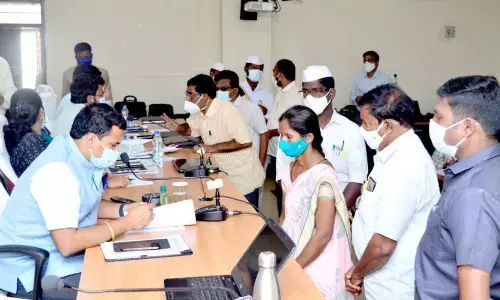 District Collector V Vijaya Rama Raju receiving petetions from the public during Spandana in Kadapa on Monday.