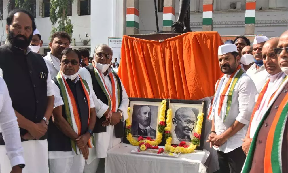 TPCC president and MP A Revanth Reddy unveiled the Congress party flag narking the 137th anniversary of Congress formation day at Gandhi Bhavan on Tuesday