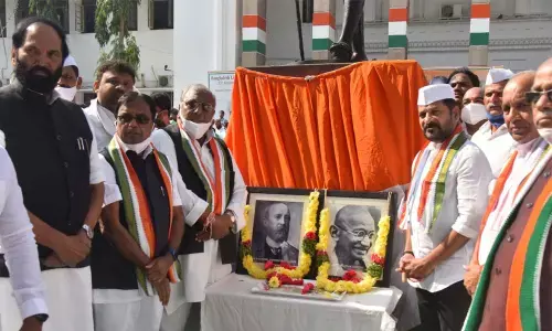 TPCC president and MP A Revanth Reddy unveiled the Congress party flag narking the 137th anniversary of Congress formation day at Gandhi Bhavan on Tuesday