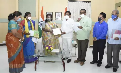 Soyam Babu Rao along with tribal representatives submitting a petition to Governor on Wednesday