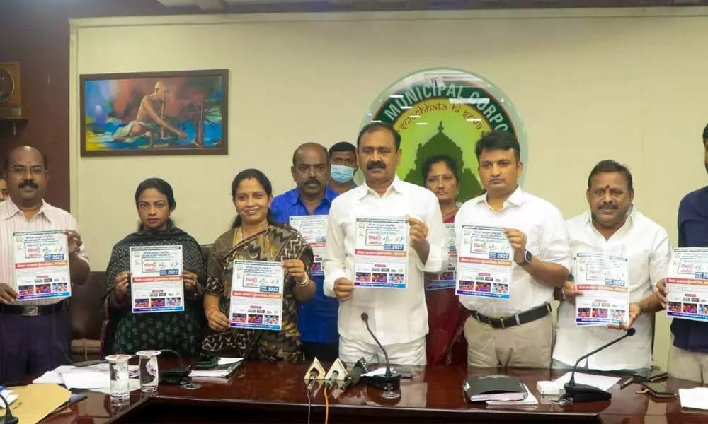 MLA Bhumana Karunakar Reddy, Municipal Commissioner P S Girisha and Mayor  Dr Sirisha releasing a pamphlet on kabaddi tourney at the Municipal Office in Tirupati on Thursday