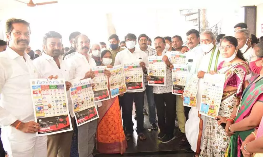 Minister Ajay Kumar releasing New Year calendar of The Han India at his camp office in Khammam on Thursday