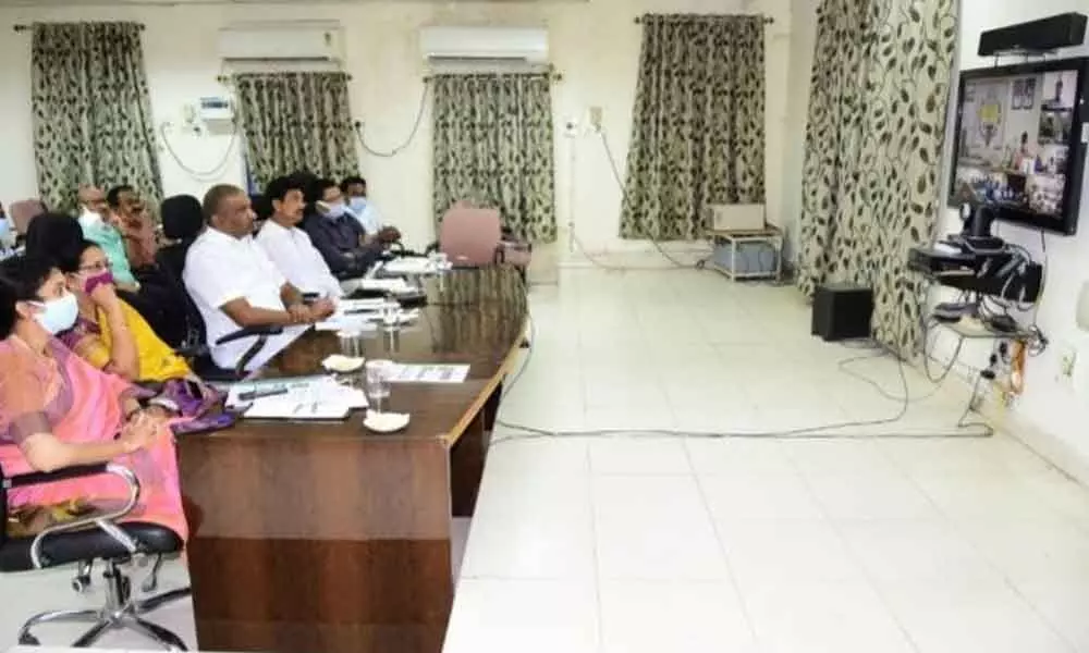 Minister K T Rama Rao holding a video conference with Mayor Y Sunil Rao in Karimnagar on Thursday