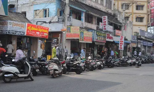 Vehicles parked on the roads near Sub-registrar office in Gandhi Nagar