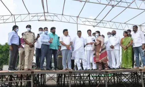District In-charge Minister Cherakuvada Sri Ranganadha Raju reviewing arrangements for the CMs visit at Pedanandipadu on Thursday. Rajya Sabha Member M Venkata Ramana Rao and MLA Ambati Rambabu are also seen