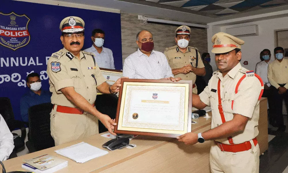 Inspector Bhanu Prakash received the award from DGP M Mahender Reddy in Hyderabad