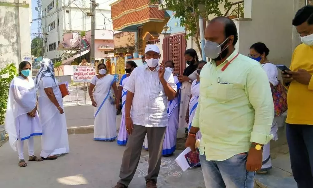 Municipal officials and health workers conducting fever survey in fourth ward in Chirala on Friday