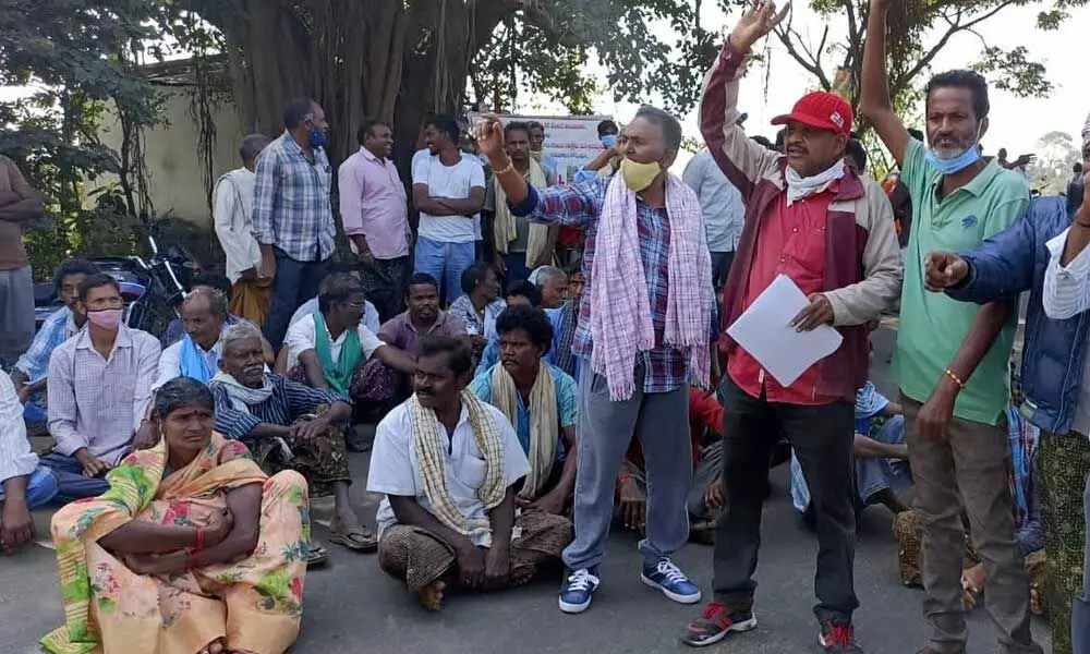 Farmers staging a dharna at police station demanding steps by authorities to drive away wild elephants from their areas, at Komarada  in Vizianagaram district on Friday