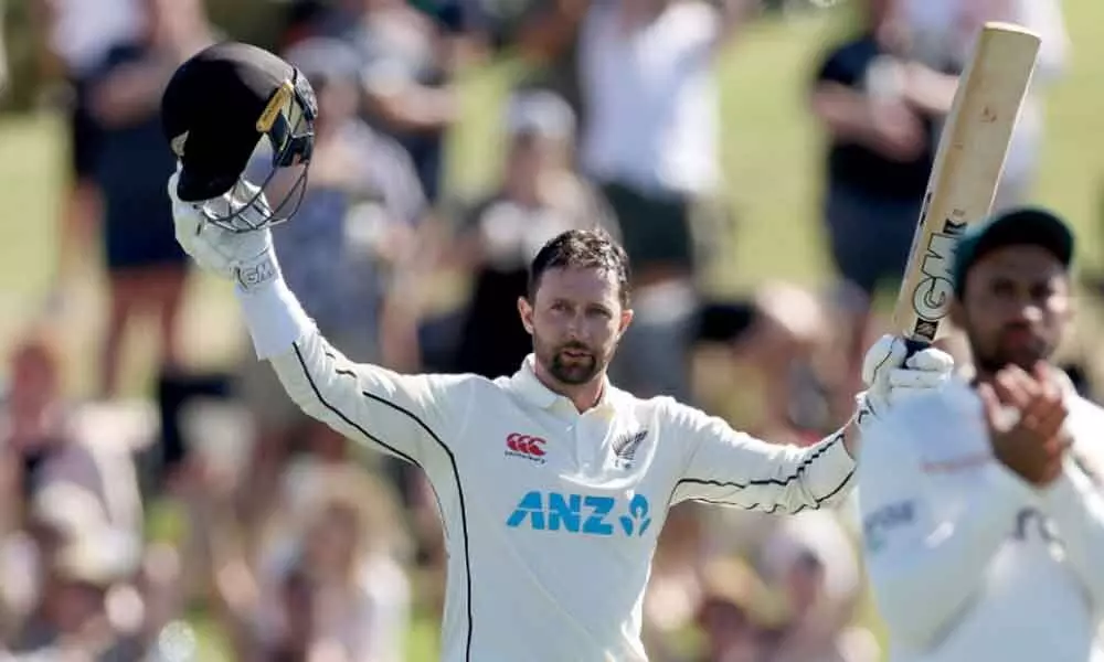 Devon Conway of New Zealand celebrates his century on Day One of the first Test against Bangladesh at Bay Oval in Mount Maunganui, New Zealand on Saturday