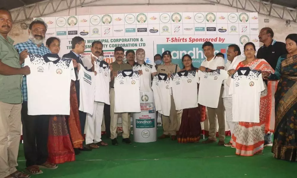 MLA Bhumana Karunakar Reddy, Urban SP Ch Venkata Appala Naidu, Mayor R Sirisha, Municipal Commissioner P S Girisha and others unveiling the players’ T-shirts in Tirupati on Sunday