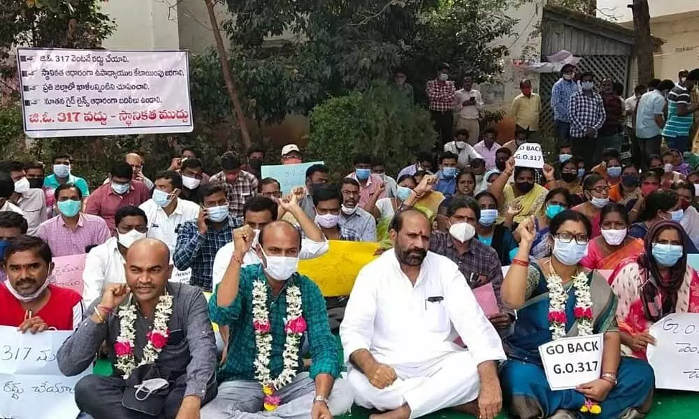 Teachers staging protest in front of DEO office in Hanumakonda on Sunday