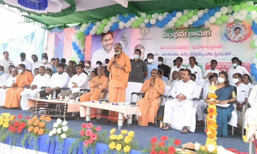 Panchayat Raj and Rural Development Minister P Ramachandra Reddy addressing a meet held at Nadimpalli village in Punganur on Sunday