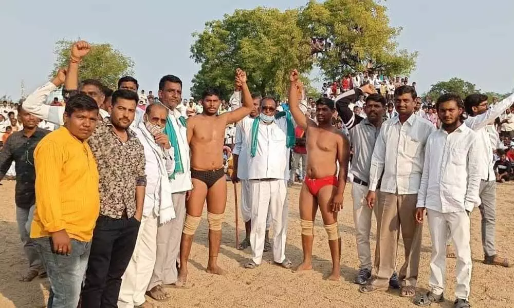 Wrestlers taking part in the competition held at Jukkal mandal in Kamareddy district on Sunday