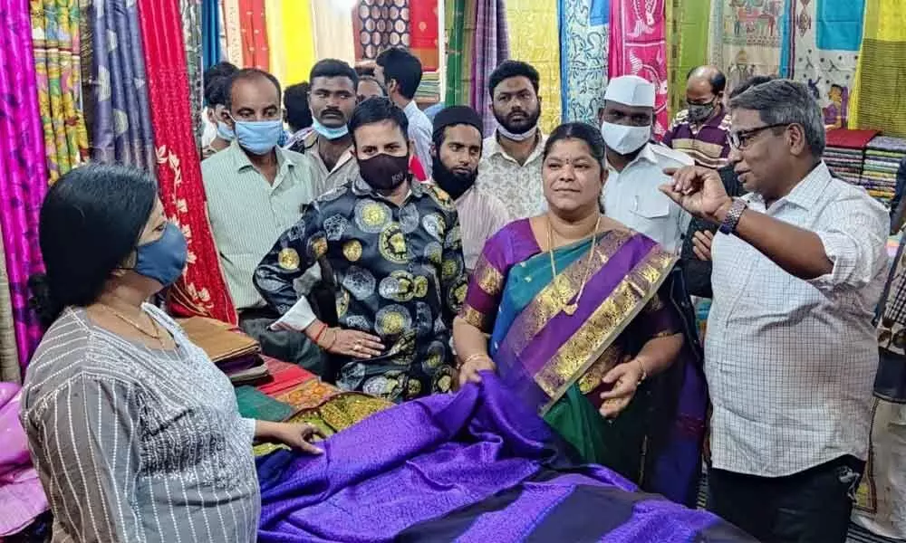 Mayor G Hari Venkata Kumari browsing through the handloom weaves at the Indian Silk Handloom and Hand-Crafted exhibition that began in Visakhapatnam on Sunday