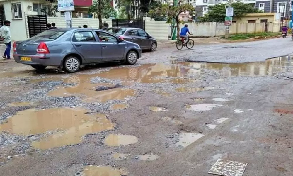 Two suspended for not meeting pothole filling target