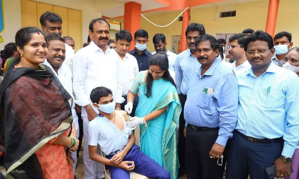 MLA Bhumana Karunakar Reddy, Municipal Commissioner P S Girisha and Mayor Dr Sirisha inaugurating Covid vaccination drive for children at MGM High School in Bairagipatteda in Tirupati on Monday