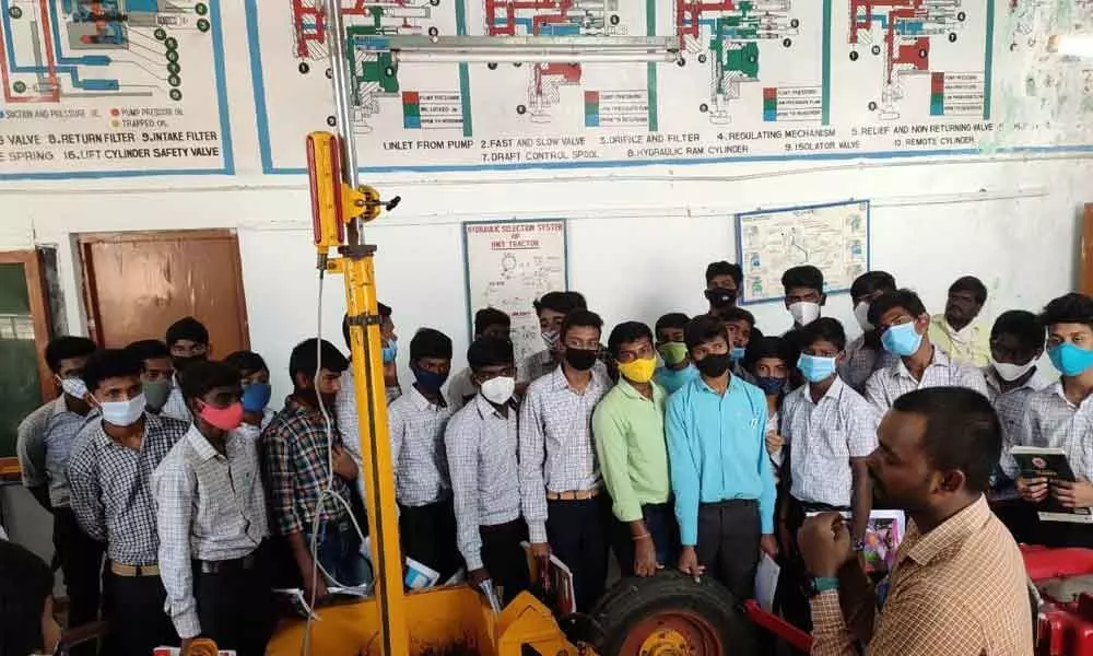 YVSRCET Principal Dr M Suresh Babu interacting with agriculture students at the agri-lab in the Farm Machinery Institute in Garladinne mandal