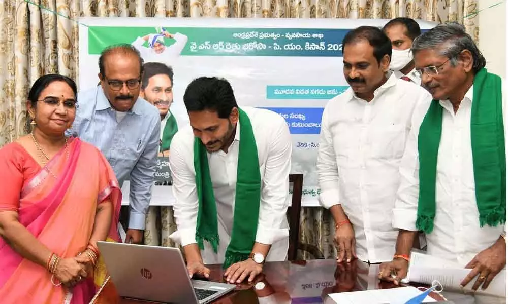 Chief Minister Y S Jagan Mohan Reddy  credits Rythu Bharosa amount into the accounts of farmers at his camp office in Tadepalli on Monday