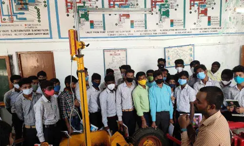 YVSRCET Principal Dr M Suresh Babu interacting with agriculture students at the agri-lab in the Farm Machinery Institute in Garladinne mandal