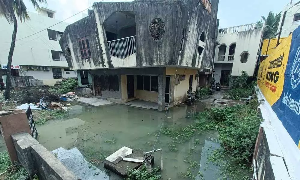 Stagnant drain water near the  houses located adjacent to the Tirumala bypass road at Leela Mahal Circle in Tirupati