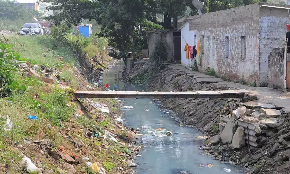 Drain filled with garbage adjacent to the area