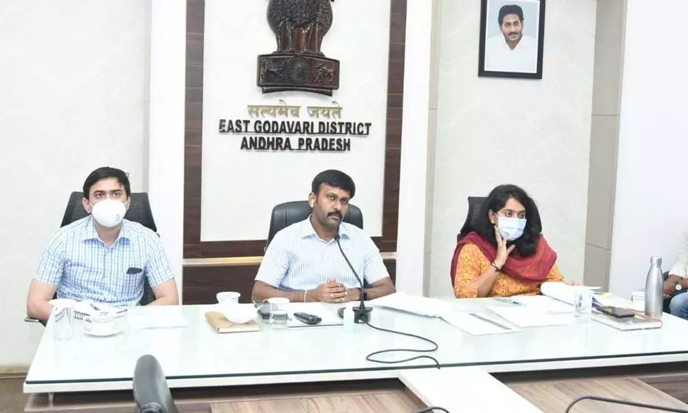 District Collector Chevuri Hari Kiran addressing a review meeting in Kakinada on Tuesday