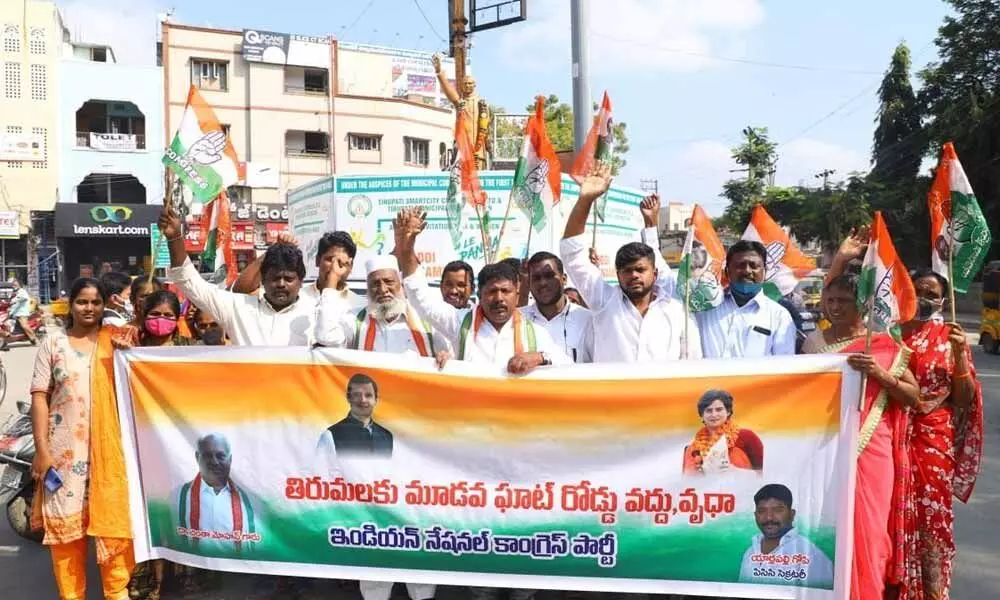 Congress activists stage a dharna in Tirupati on Wednesday against the proposal for third ghat road to Tirumala