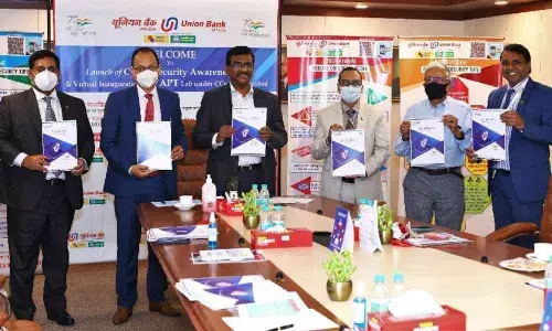 Rajkiran Rai G, MD and CEO, Union Bank of India,  Executive Directors Gopal Singh Gusain, Nitesh Ranjan, Rajneesh Karnatak and others at the launch of cybersecurity awareness kit at their cybersecurity COE in Hyderabad
