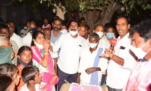The farmers conducting celebrations on  getting good price for cotton at the market yard in Khammam on Wednesday