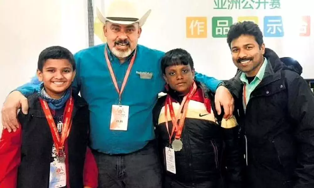 Sunil paul and his students during a visit to China to attend RoboRAVE asia competition