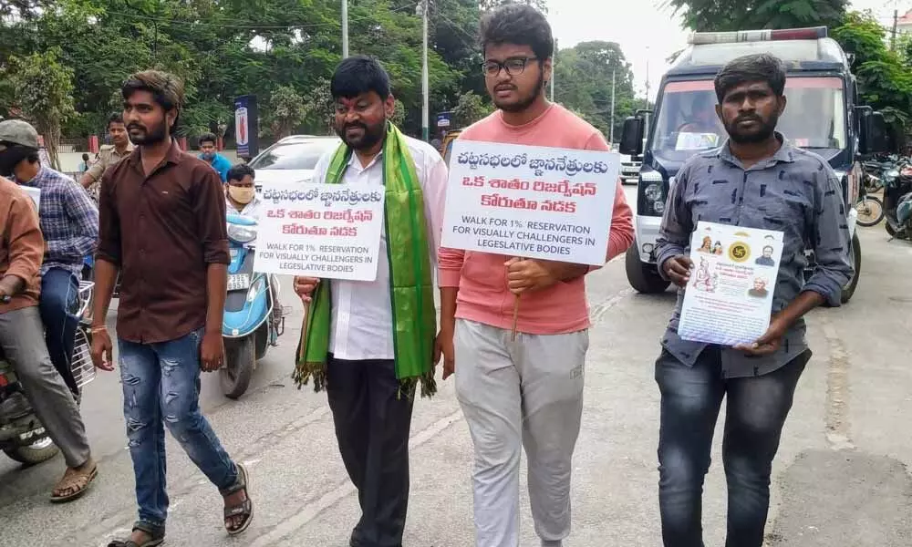 Ponnaluri Srinivasa Phani on padayatra from Narayanadri to Indrakeeladri demanding reservation to blind people in legislative houses, at Ongole on Saturday