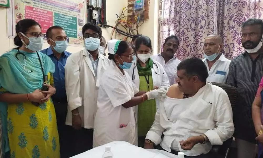 Tourism Minister M Srinivasa Rao receiving a Covid jab at Madhurawada Primary Health Centre in Visakhapatnam on Saturday