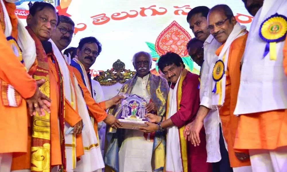 Haryana Governor Bandaru Dattatreya being felicitated at Antarjatiya Telugu Sambaralu organised by Andhra Saraswata Parishat in Bhimavaram on Saturday