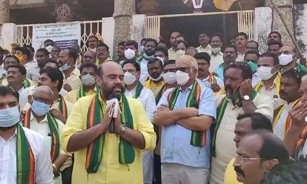TDP leader Baby Nayana speaking at a dharna staged by party activists at Bobbili in Vizianagaram district on Saturday. Former Union Minister P Ashok Gajapathi Raju and others are seen.