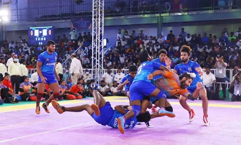 Players of Andhra and SSB teams in action during their quarterfinals match on the fourth day of the National Invitation Kabaddi tournament in Tirupati on Saturday. (Photo: Kalakata Radha Krishna)