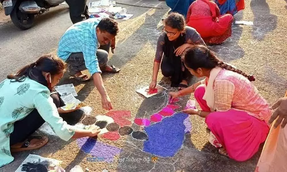 Andhra University students designing rangoli at the campus as a part of  pre-Sankranti celebrations in Visakhapatnam