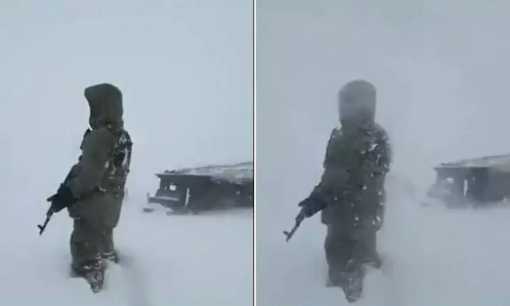 Watch The Trending Video Of A Soldier Standing Courageously In Knee-Deep Snow In The Midst Of A Storm In Kashmir