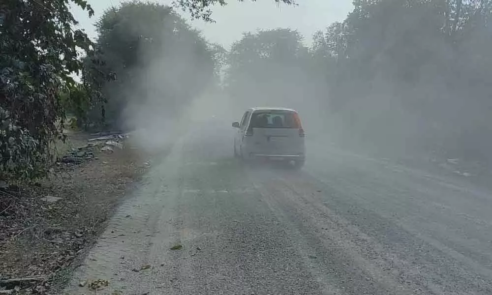 A cloud of dust between Pasra and Narlapur, a major road leading to Medaram