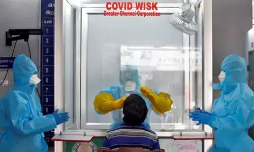 A healthcare worker takes sample of a person for Covid-19 test in Chennai on Monday.(Reuters Photo)